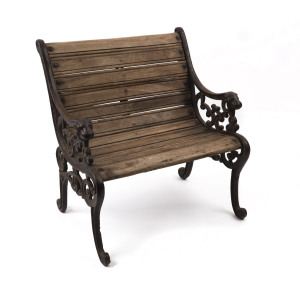 A salesman's sample antique garden seat, cast iron with timber slats, ​50cm high, 48cm wide, 39cm deep