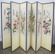 A Chinese eight fold screen with silk embroidered panels and calligraphy parchment backs, mid to late 20th century, 170 x 352cm