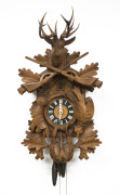 A Black Forest cuckoo wall clock with twin weight movement, 20th century, ​65cm high