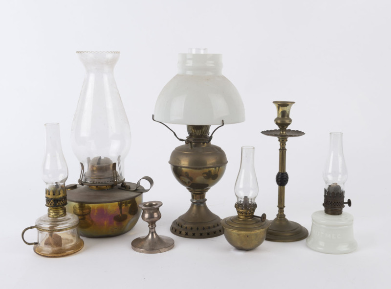 Five assorted oil lamps, a brass candlestick and an English sterling silver candle holder, 19th and early 20th century, (7 items), ​the largest 30cm high