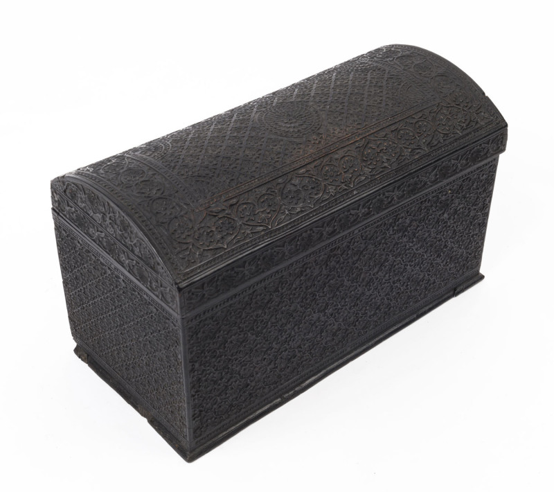 An Anglo-Indian compendium dome topped box, ornately carved in ebony, mid 19th century, 15cm high, 25cm wide, 13cm deep