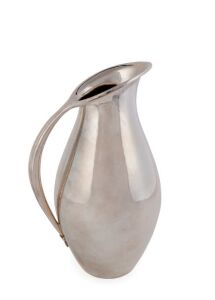 A silver water pitcher designed by Johan Rohde (1856-1935) for George Jensen; design 432A; 22.5cm high; 565gms. Johan Rohde began designing products for Jensen in 1906. His designs have much in common with Jensen's own; both silversmiths used the same oxidisation technique and their pieces bear characteristic hammer marks. However, Rohde's designs are highly stylised in comparison to Jensen's more natural Art Nouveau style.
