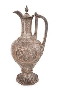 A superb Victorian sterling silver wine jug with engraved and embossed scroll decoration, by Richard Martin & Ebenezer Hall & Co. Ltd., Sheffield 1869. 33cm high, 960grams.