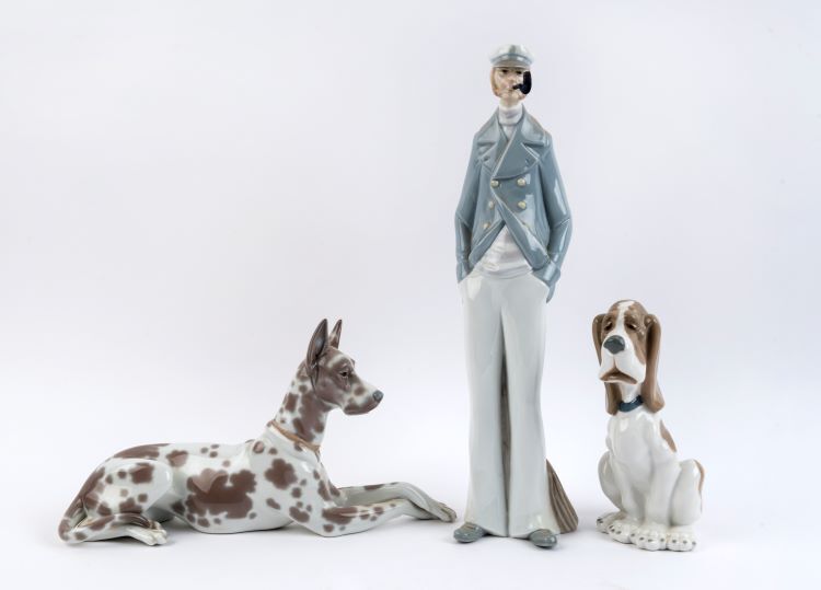 LLADRO Spanish porcelain sailor statue together with a Great Dane statue and a NAO Great Dane hound statue, 20th century, (3 items), the tallest 38cm high