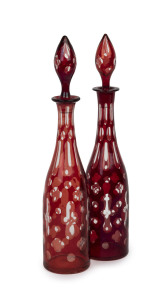 A pair of Bohemian ruby overlay decanters, mid 19th century, 41cm high