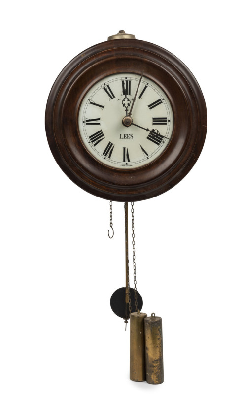 An antique wall clock with twin weight alarm movement, late 19th century, dial marked "LEES, Made in Baden", 27cm diameter