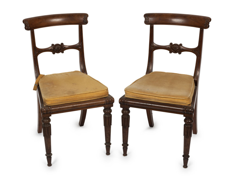 A fine pair of antique mahogany spade back dining chairs with rush seats, circa 1820
