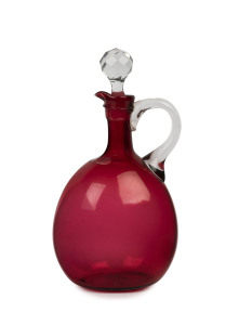 An antique ruby glass wine jug with stopper, mid 19th century, 25cm high