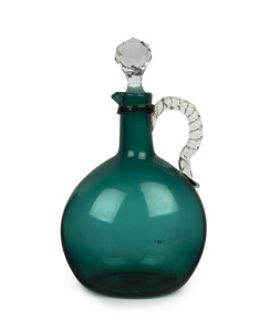 An antique green glass wine jug with stopper, mid 19th century, 24cm high