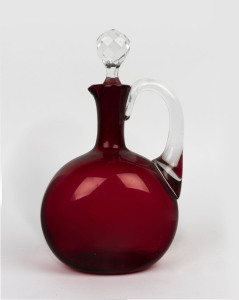 An antique ruby glass wine jug with stopper, mid 19th century, 26cm high