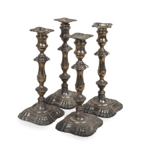 A set of four English sterling silver candle sticks, Sheffield circa 1904, weighted bases, 32cm high