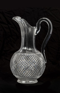 A Georgian English crystal jug with finely cut checkerboard design, circa 1800, 25cm high