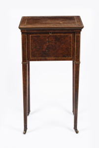 An antique lady's lift-top work table, amboyna with string inlay, silk lined interior with two drawers and leather implement compartments under the lid, 19th century, 77cm high, 42cm wide, 37cm deep