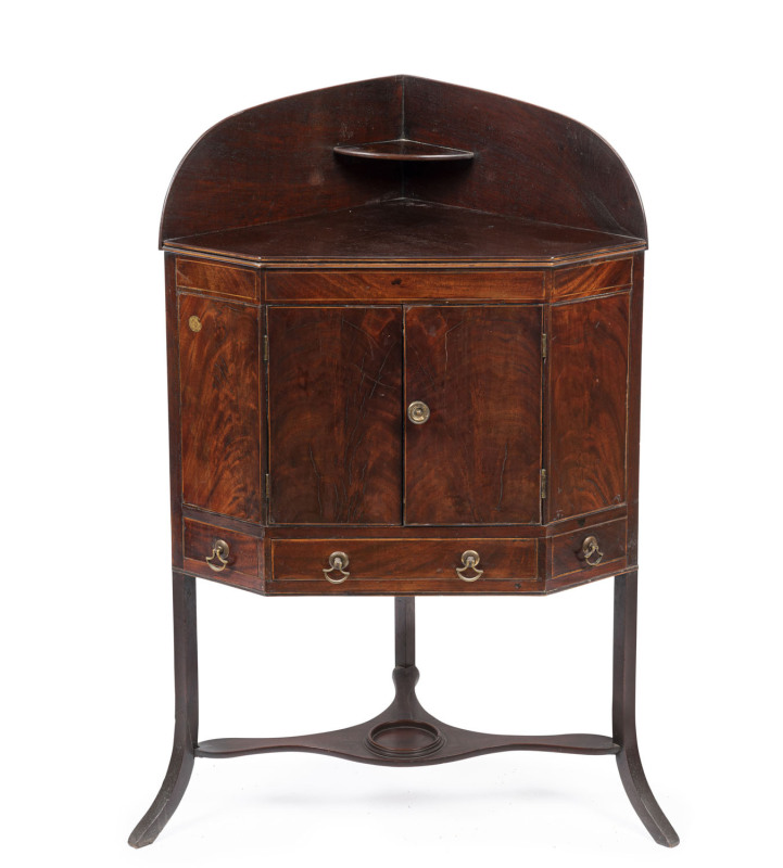 A Georgian mahogany washstand, rare corner example, circa 1790, 101cm high, 66cm wide, 44cm deep