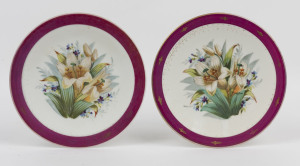 A pair of antique English cabinet plates with hand-painted floral scenes, mid 19th century, 23cm diameter