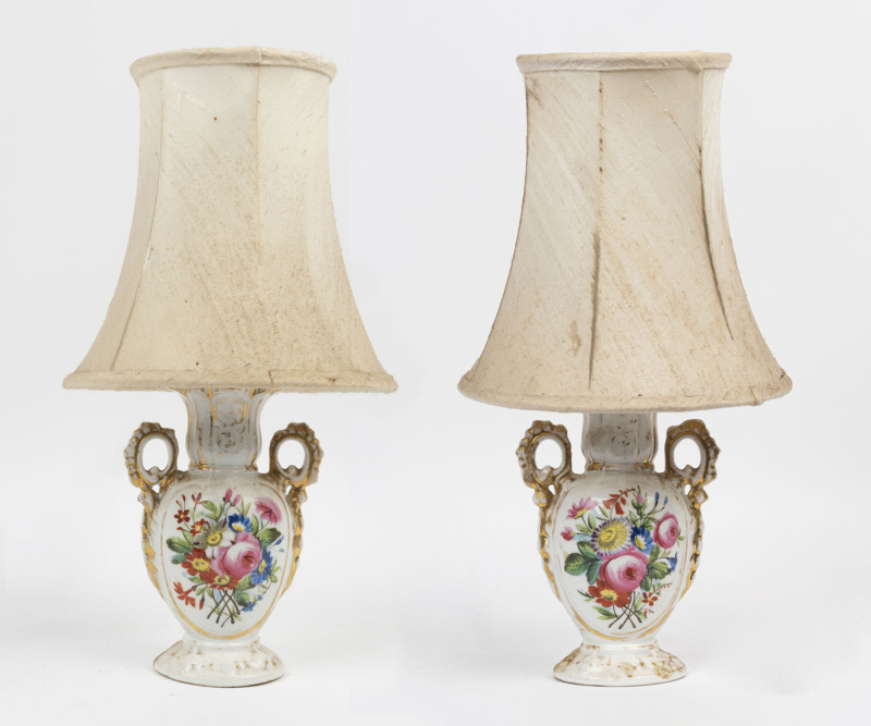 A pair of antique English soft-paste porcelain vases converted into electrified table lamps with shades, 40cm overall