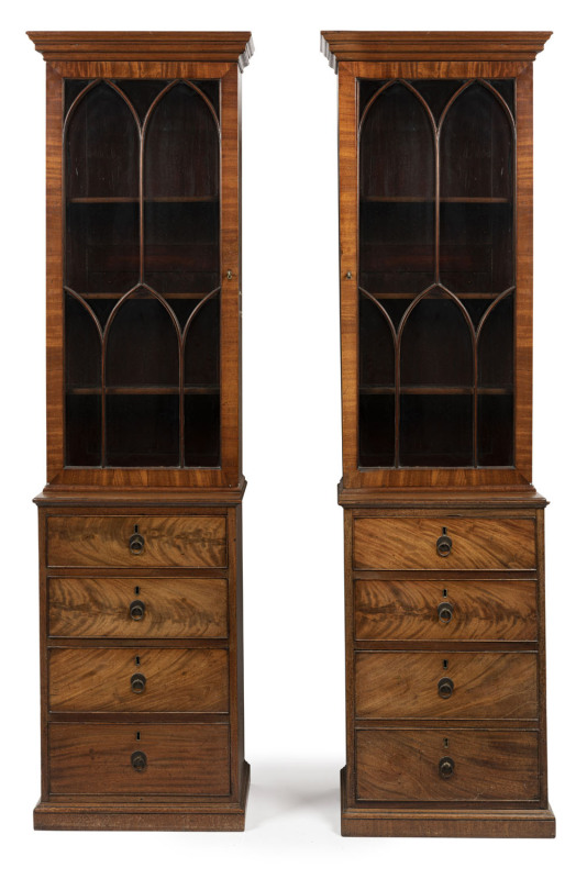 A rare pair of antique English Hepplewhite mahogany bookcases, 18th century, unusual slim proportions with flame mahogany drawer fronts, cockbeading and astragal glazed doors with adjustable shelving. With accompanying documentation from Windsor Antiques,