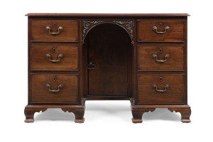 An antique lady's desk, twin pedestal with carved kneehole opening in mahogany, early to mid 19th century, 74cm high, 108cm wide, 54cm deep