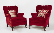 A pair of red velvet upholstered armchairs with cabriole legs, mid 20th century, 69cm across the arms