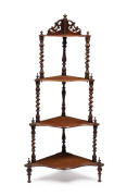A Colonial Australian cedar four tier corner wotnot, circa 1885, 125cm high, 55cm wide, 35cm deep