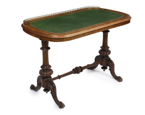 An antique English walnut occasional table with tooled leather top and brass gallery, circa 1870, 68cm high, 104cm wide, 60cm deep