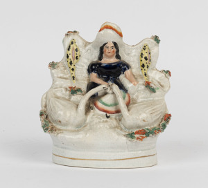 STAFFORDSHIRE figure group of a seated lady and swans, circa 1840, ​13cm high