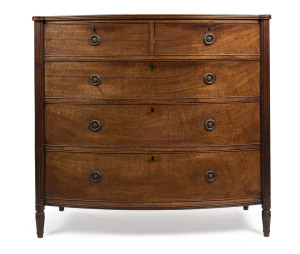 A fine Georgian mahogany bow front chest of five drawers with cockbeaded detailing, reeded edge and fluted columns, early 19th century, 105cm high, 109cm wide, 59cm deep