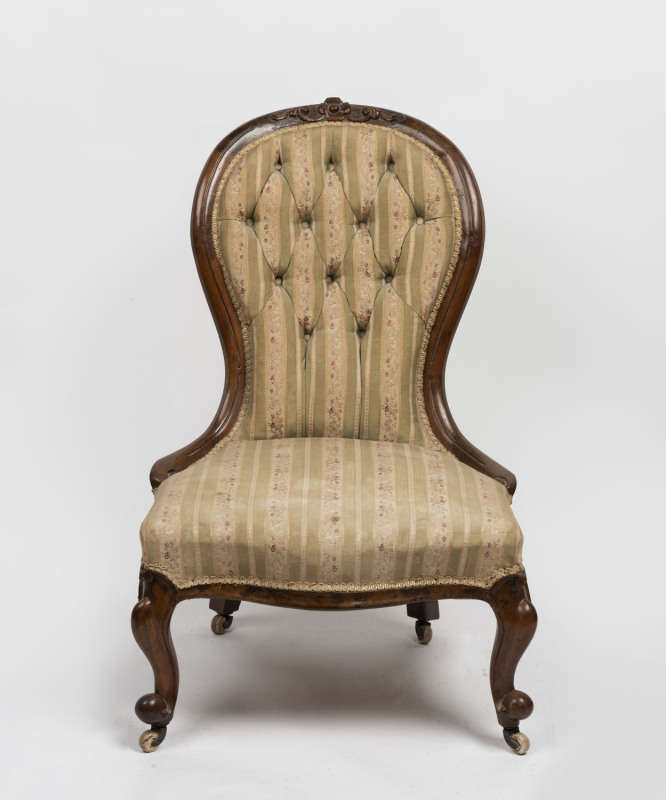 An antique ladies parlour chair, carved walnut frame with button back upholstery, circa 1880, 91cm high
