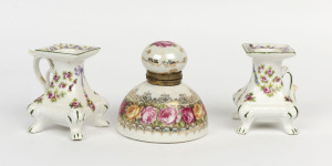 A pair of floral porcelain candle holders together with a continental porcelain inkwell, 19th and 20th century, (3 items), the inkwell 11cm high, 10cm diameter