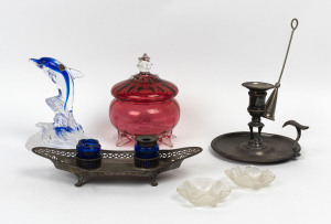 Ruby glass lidded bowl, glass dolphin ornament, two Italian glass pin dishes, silver plated candle holder with snuff and a desk tray, 19th and 20th century, (6 items), the dolphin statue 16cm high