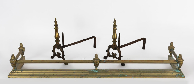 An antique brass fire curb and pair of brass fire dogs, 19th/20th century, 120cm wide