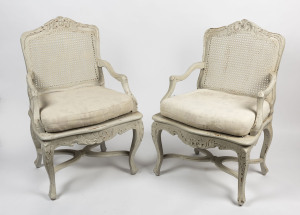 A pair of French provincial style armchairs, carved timber with lime washed finish, 20th century,
