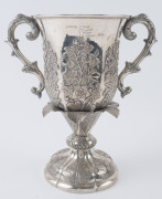A Chinese Export Silver two-handled presentation cup, with embossed flowers and raised on a shaped circular base with a band of acanthus leaves. By CUTSHING, 8 New China Street, Canton, circa 1853, 26.5cm high, 1630gms. - 4