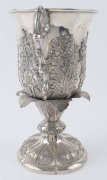 A Chinese Export Silver two-handled presentation cup, with embossed flowers and raised on a shaped circular base with a band of acanthus leaves. By CUTSHING, 8 New China Street, Canton, circa 1853, 26.5cm high, 1630gms. - 5