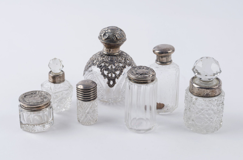 Group of seven assorted sterling silver and crystal vanity bottles, 19th and early 20th century, ​the largest 11cm high
