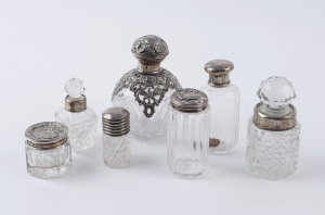 Group of seven assorted sterling silver and crystal vanity bottles, 19th and early 20th century, the largest 11cm high