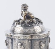 An antique Chinese silver teapot adorned with vignettes of country scenes and floral sprays, Foo dog finial with remains of gilt highlights, 19th century, 18cm high, 17cm wide, 565grams - 6