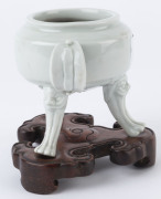 Blanc de chine three legged pot on carved timber stand, 19th/20th century, 13.5cm high overall - 3