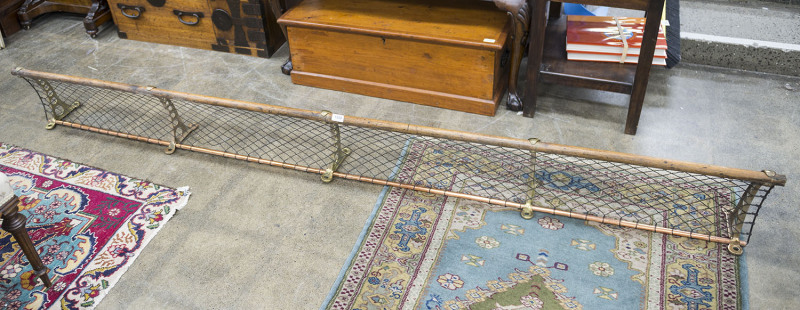 An antique railway luggage rack, copper brass and hardwood with wire mesh, 19th/20th century, ​260cm long