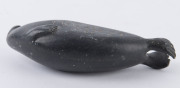 A Canadian Inuit greenstone carving in the form of a walrus, signed and numbered to the base, 20th century, 12cm long - 5
