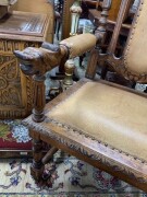 A pair of French carved oak armchairs with brown leather upholstery and rampant lion crests, 19th century, 65cm across the arms - 2