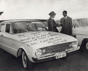 WEST INDIES - 1960-61 TOUR OF AUSTRALIA: photograph of West Indian Captain Sir Frank Worrell receiving keys for a hire car, dated "Hobart 5.1.61" and Launceston "10.1.61" with signed dedication "Appreciated your fine gesture in providing us with transport in Tasmania. The Falcon, a great little car ! Your sincerely Frank Worrell", 25 x 30.50cm.
