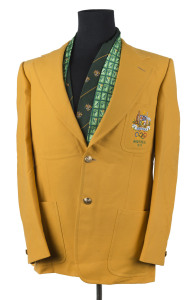 1976 Montreal: Official Olympic Team blazer; made by Fletcher Jones, in yellow wool with the Australian Coat of Arms and the Olympic rings embroidered on the pocket with "MONTREAL 1976" below. Dated 24.5.76 on the manufacturers' label and named for D. HIL