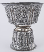 A Laotian silver footed bowl with repousse decorated and alternating panels of the three-headed elephant (airavata) and deities, separated by elaborate floral scrolling and borders with foliate lotus leaf pattern, early 20th century. A silver plaque attac - 3