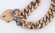 An antique rose gold curb link bracelet with heart lock, each link stamped "9c", the lock stamped "15" with anchor and pictorial mark, 19th century. ​25 grams total - 4