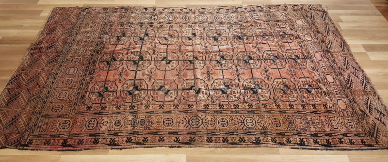 An antique hand-knotted wool rug, early 20th century, ​255 x 147cm