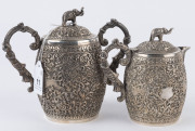 An Indian silver sugar bowl and jug adorned with animals in foliate motif and elephant finials with raised trunks, 19th century, (2 items), 12cm and 15cm high, 890 grams total - 2