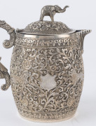 An Indian silver sugar bowl and jug adorned with animals in foliate motif and elephant finials with raised trunks, 19th century, (2 items), 12cm and 15cm high, 890 grams total - 3