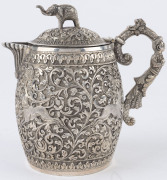 An Indian silver sugar bowl and jug adorned with animals in foliate motif and elephant finials with raised trunks, 19th century, (2 items), 12cm and 15cm high, 890 grams total - 6