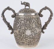 An Indian silver sugar bowl and jug adorned with animals in foliate motif and elephant finials with raised trunks, 19th century, (2 items), 12cm and 15cm high, 890 grams total - 10